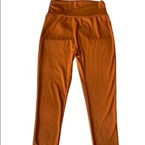 Burnt orange workout leggings. Never worn.